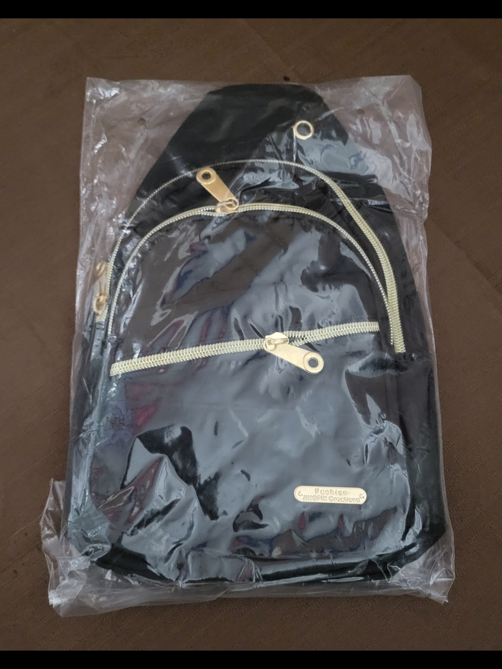 Quilted Black Women's Sling Bag with Gold Accents